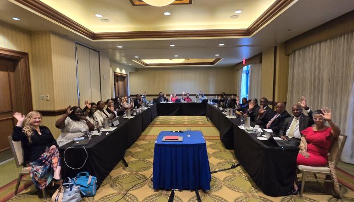Meeting room with CARICOM Delegates around a horseshoe table